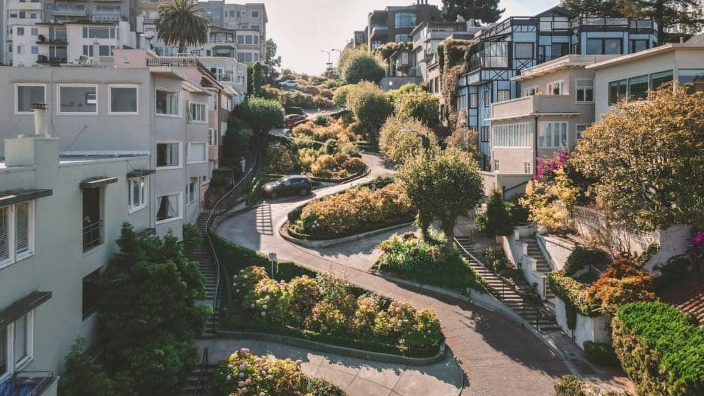 Cool picture of Lombard Street with cars.