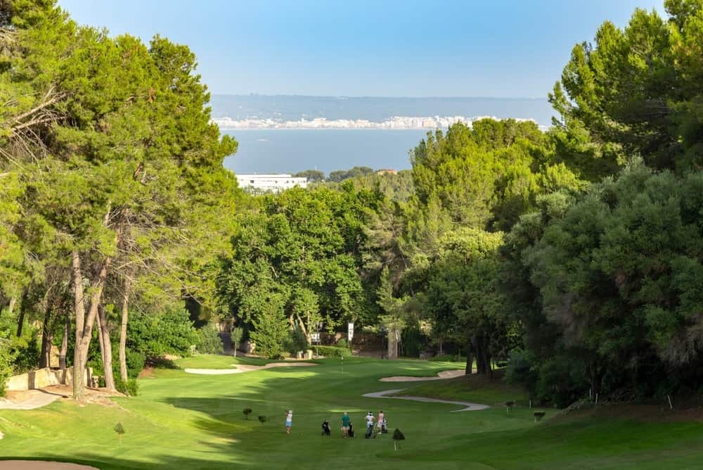 People playing downhill atht the local Son Vida Golf course.