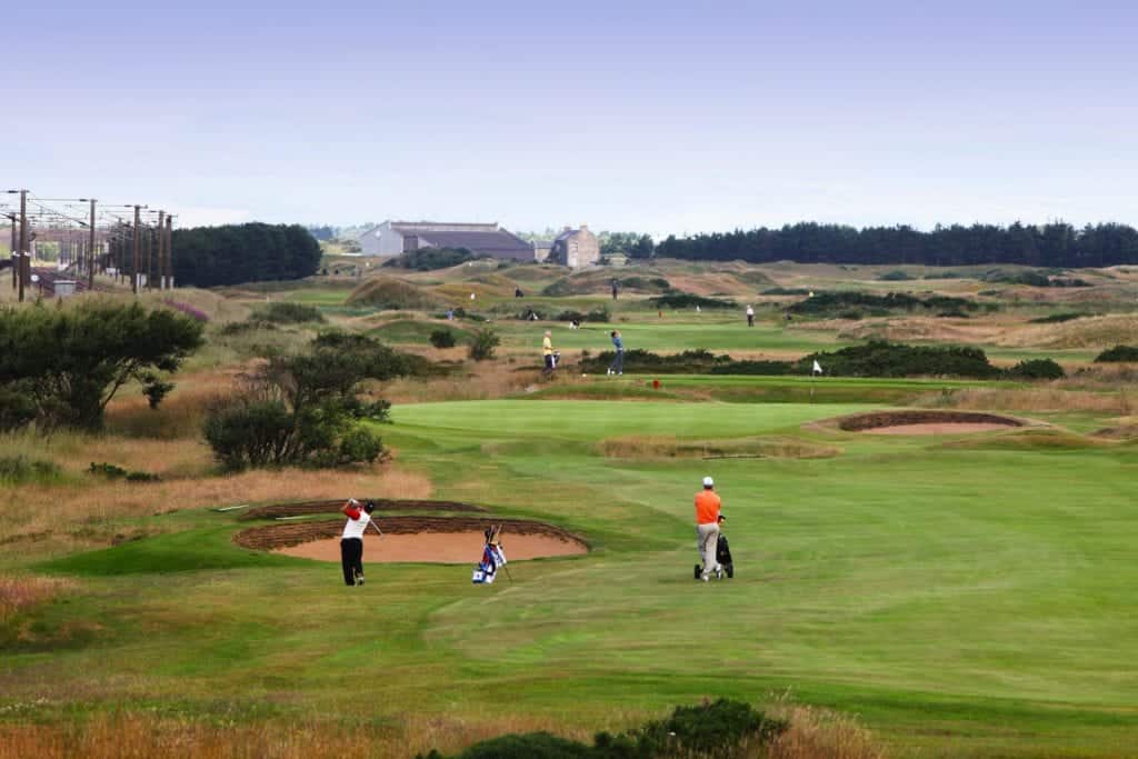 Two men playing golf at Kilmarnock Barassie.